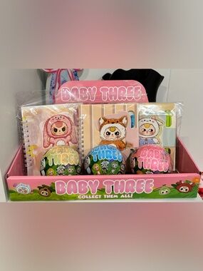 Baby Three Collectible Surprise Toy Set - Mystery Ball and Notebook with Pen